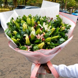 elegant lily and eucalyptus bouquet.anniversary flowers delivery in Ruaka